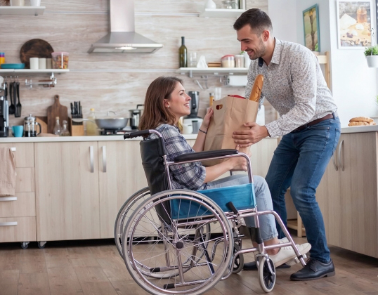 Housemates sharing a meal in a Supported Independent Living home